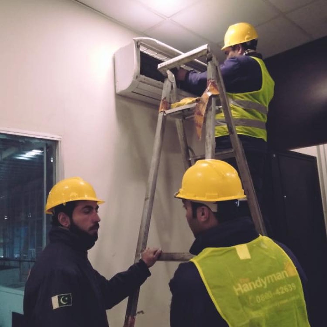 Aircon Technicians working on Split Airconditioner